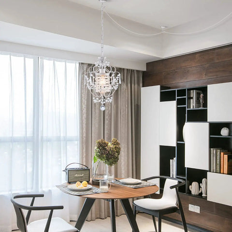 Plug In Mini Crystal Chandelier, White Retro Ceiling Light above dining room table with iron frame accents.