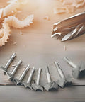 Meichoon Forstner drill bit set, 16 pcs, 15–35 mm, carbide, front view on wooden workbench with shavings
