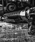 Air Nibbler With Angled Head 4200 SPM Front Exhaust Cuts Up To 18 Gauge Steel Aluminum Or Plastic Ergonomic Grip Laying on Wood Surface