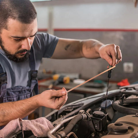 Mechanic using Copper Coated Gouging Carbon Rods Set For Auto Welding And Dent Repair 5 Piece Arc Gouging Sticks With Quick Dent Fix Feature Pro Grade Welding Gear For Car Body Repairs And Maintenance