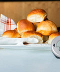 DOT Alarm Thermometer For Chefs One Touch Temperature Target Quick Reliable Kitchen Probe on table beside baked bread rolls.