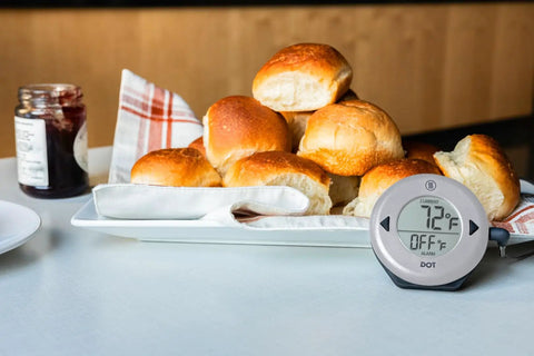 DOT Alarm Thermometer For Chefs One Touch Temperature Target Quick Reliable Kitchen Probe on table beside baked bread rolls.