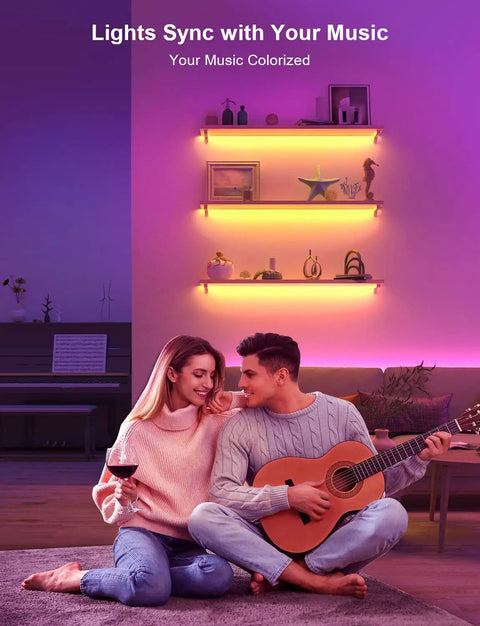 Couple enjoying music with RGB LED Strip Lights 32.8Ft With 5050 LEDs Color Changing Rope Lights in a cozy living room setting.