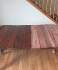 A wooden dining table with half polished using All In One Wood Polish And Conditioner With Carnauba Wax And Beeswax, 64 oz.