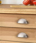 Installed 5 Pack Brushed Nickel Cup Cabinet Pulls With 3 Inch Hole Centers on wooden kitchen drawers
