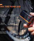 Mini Portable Bike Pump With Slick Digital Gauge And Taillight 130 PSI Electric Air Pump in use, showing LED screen and taillight.