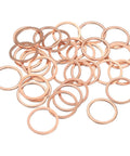 Hella Tough 52 Piece Flat Copper Washers 22 X 27 X 1.5 Mm Metric Sealing Crush Ring Gaskets For Hydraulic Fittings laid out neatly.