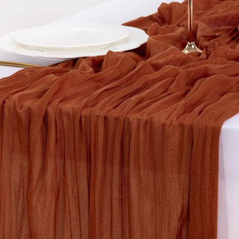 Rustic Terracotta Table Runner Hand Dyed From Breathable Cheesecloth on a table, perfect for wedding decor, 35"W x 120"L.