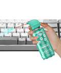 Hand holding Powerful Air Duster For Computers And Keyboards Compact 3.5oz Can Quick Dusting For Tight Corners over keyboard