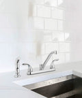 Two Handle Kitchen Faucet With Side Spray In Polished Chrome, Modern High Arc Sink Faucet installed in white tiled kitchen