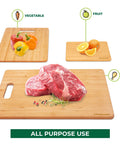 Bamboo Cutting Board Set of 3 for Kitchen with meat, vegetables, and fruit displayed on lightweight wood prep boards with hanging hole.