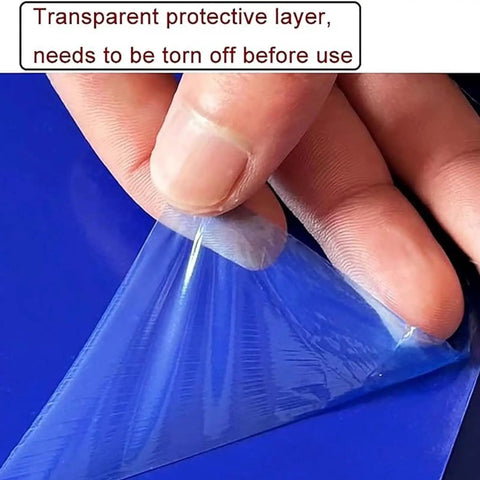 Hand peeling a transparent protective layer off a blue mat, preparing for use. Heavy Duty Adhesive Mats To Trap Dust And Grime Effortlessly Peel And Replace Sticky Floor Pads For Cleanrooms Clinics And Construction Sites No Sweat Cleanup 300 Sheets Roll.