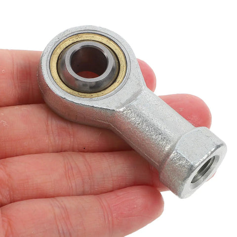 Bulletproof M10x1.25 Internal Thread Rod End Bearings With Fish Eye Radial Joints Hardened Steel in hand, showcasing sealed bearing.