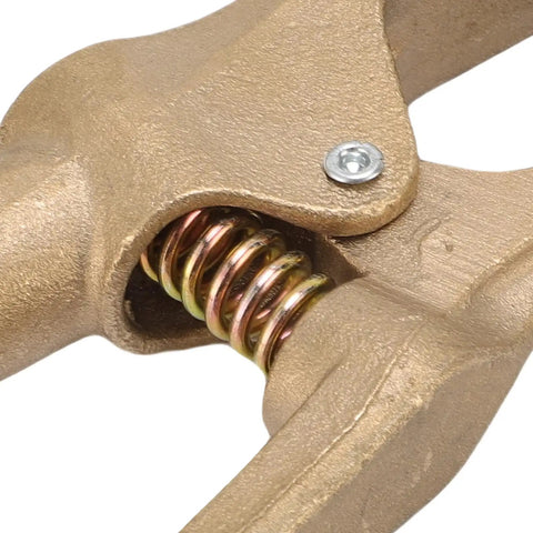 Close-up of Sturdy Brass A Shaped Welding Ground Clamp With High 300 Amp Conductivity showing spring and jaw mechanism for reliable connections.