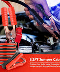 Close-up of red and black Grab And Go Emergency Car Kit jumper cables connected to a car battery, showcasing 8.2FT length.
