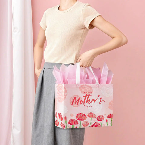 Woman holding Two Pack 13 Inch Large Mothers Day Gift Bags With Handles, Reusable Nonwoven Floral Gift Bags With Cards, Comes With Tissue Paper