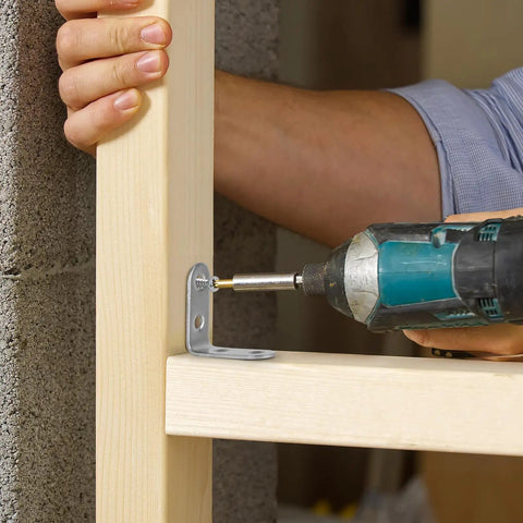 Person installing 24 Pack Heavy Duty L Brackets With Screws Rust Resistant Stainless Steel on a wood shelf.