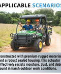 Two people driving John Deere Gator with Upgraded 12V Electric Cargo Box Lift Kit Actuator through field