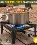 Heavy Duty Cast Iron Propane Burner With Adjustable Regulator Hose For Outdoor Camping And Wok Cooking Portable Gas Stove 65 Pound Max Load High Heat Precision Control in use with cooking pot on table