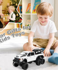 Child playing with Tough As Nails 1 To 24 Diecast Off Road Pickup Toy Truck With Light And Sound, Metal Construction, 6x6 Off Road Vehicle.