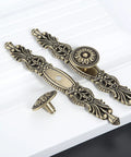 Vintage Cabinet Pulls Set of 5 in Antique Bronze With 3.7 Inch Hole Spacing shown on a white surface with decorative design