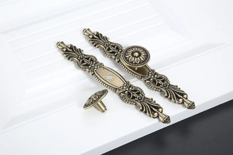 Vintage Cabinet Pulls Set of 5 in Antique Bronze With 3.7 Inch Hole Spacing shown on a white surface with decorative design