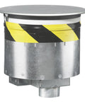 Heavy Duty Fire Rated Poke Through Floor Outlet With Built Tough Cast Aluminum Cover showing a recessed design and safety stripes.
