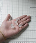 Real Deal 25 Pack Glass Retainer Clips With Screws For Cabinets Windows Doors And Mirrors Universal Clear Transparent Panel Hardware All Weather Zero Drama Install held in hand.