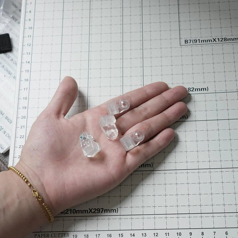 Real Deal 25 Pack Glass Retainer Clips With Screws For Cabinets Windows Doors And Mirrors Universal Clear Transparent Panel Hardware All Weather Zero Drama Install held in hand.
