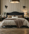 Queen Size Velvet Upholstered Bed Frame With Tall Wingback Headboard And Channel Quilting Modern Retro Bedroom Furniture In Black, styled with neutral bedding.