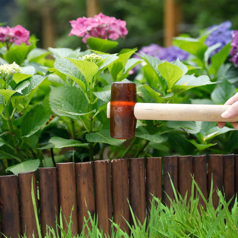Installing Wooden Garden Edging Border With Burnt Wood Finish Flexible No Dig Landscape Border around flower bed.