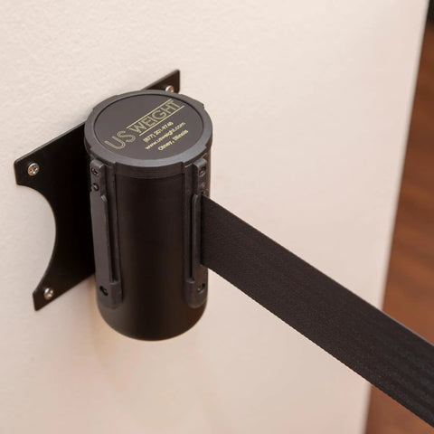 Wall-mounted black barrier with 8-foot retractable belt showing safe braking system and easy install design for crowd control.