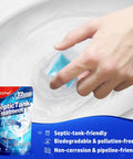 Hand using blue dissolvable enzyme pack from Septic Tank Treatment 12 Pack For 1 Year Supply for easy operation and odor reduction.