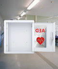 White metal AED cabinet wall mount with viewing window showing AED label; fits all brands.
