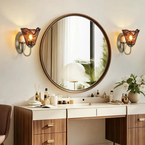Vintage Glass Wall Sconces Set of 2,Aged Brass Bathroom Vanity Lighting above a stylish vanity with round mirror.