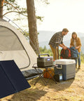 100W Portable Foldable Solar Panel Suitcase With 10A 12V MPPT Controller next to a tent in a camping setup