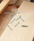 100 Pack Self Tapping Wood Screws 28mm By 4mm Galvanized Iron For DIY Furniture Assembly scattered on wood surface
