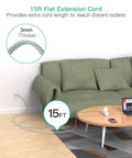 Heavy Duty Surge Protector Power Strip With 15 Foot Extension Cord Featuring 13 Outlets And Four Smart Usb Ports For Plug And Play Hella Smooth Multi Device Charging Setup near green couch.