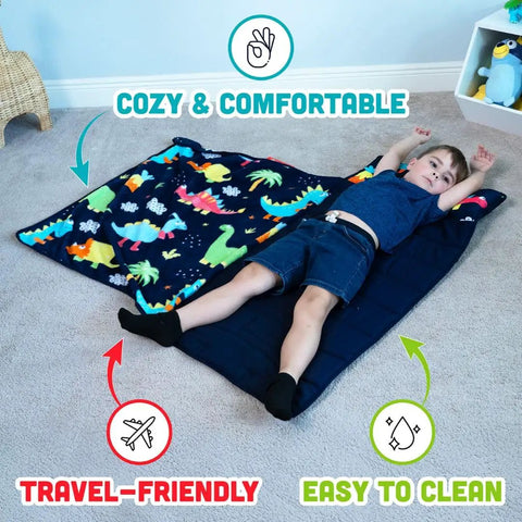 Child lying on dinosaur-themed Toddler Nap Mat With Pillow For Daycare And Travel Soft Cozy Portable Kid-Friendly OEKO-TEX Certified