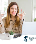 Woman smiling at a desk with a glass of water, representing fresh water using Compatible PUR Water Filter Replacement Cartridges 6 Pack