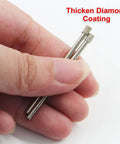 Diamond drill bits; close-up of two 3mm diamond-coated bits held between fingers