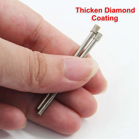 Diamond drill bits; close-up of two 3mm diamond-coated bits held between fingers