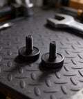 Two lock bolt clamp screws for multitool repair, part 265674-6, on workbench, enhancing TM3000C and DTM50 functionality.