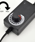 Adjustable 12V DC Fan Power Supply with dial showing min to max settings for PC fans, compatible with 3/4-pin fans and includes splitter cable
