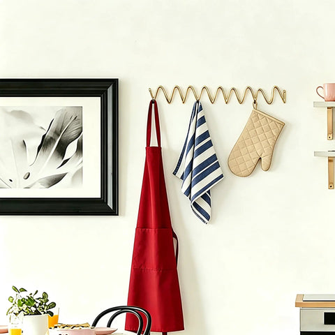 Heavy Duty Gold Wall Mounted Coat Rack With Sculpted Wavy Hooks Hanging Coats Hats Bags And Umbrellas Zero Clutter Bedroom Decor For Living Rooms And Bathrooms Top Shelf Build with red apron and kitchen towels.