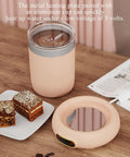 Keep Your Daily Brew Sizzling Hot This Smart Coffee Mug Warmer Uses An Ultra Smooth Metal Heating Base With Gravity Activated Control For Zero Fuss Desk Enjoyment, featuring an aluminum cup and heated coaster on wood table.