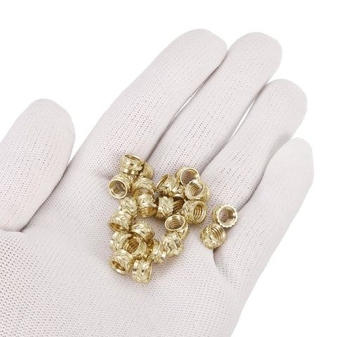 Brass Knurled Insert Nuts For 3D Printing M6 Size 5mm Length 8mm OD 30 Pieces Heat Set Female Threaded Inserts in gloved hand.