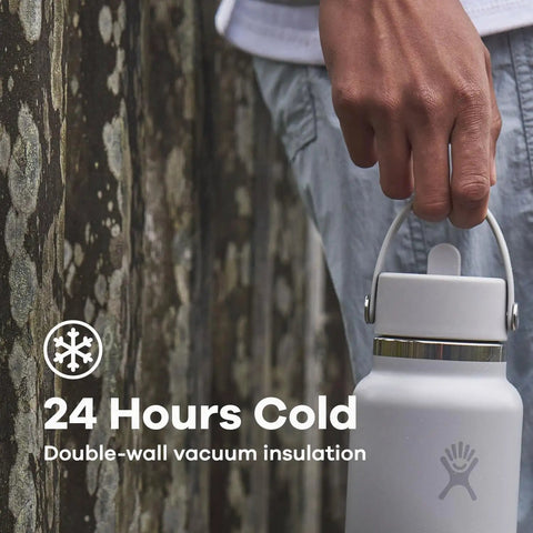 Person carrying 40 Oz Insulated Stainless Steel Water Bottle With Wide Mouth And Leakproof Straw Cap No Spill Flip Lid Double Wall Keeps Drinks Cold Up To 24 Hours Black Finish Easy Carry Handle.