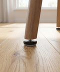 Close-up of chair leg with 12 Piece Nail On Chair Leg Sliders For Hardwood Floors Heavy Duty Plastic And Metal Floor Protectors