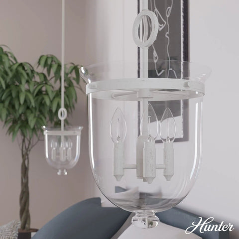 Go-To 3-Light Rustic White Pendant Light Dimmable, Medium Urn Style, Clear Glass Shade in living room setting.